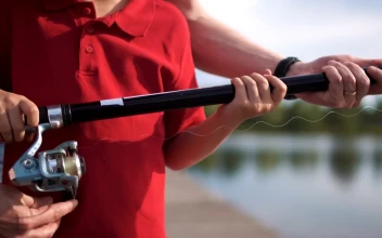 Free Video Stock teaching a kid how to fish in the lake