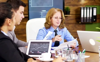Free Video Stock team leader hands out growth charts at meeting