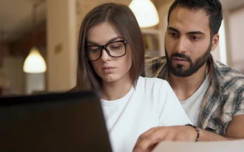 Free Video Stock team leader helps coworker solve problem