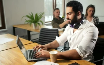 Free Video Stock team leader working happily on laptop