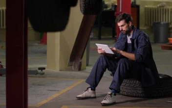 Free Video Stock technician in a mechanical workshop using a tablet