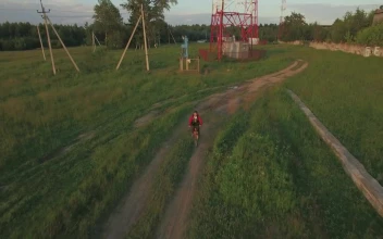 Free Video Stock teen riding a bike in the country