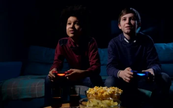 Free Video Stock teens playing a video game in a dark living room