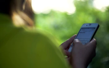 Free Video Stock texting outdoors on a smartphone