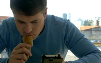 Free Video Stock texting while eating an ice cream