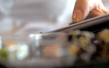 Free Video Stock texting while eating japanese food
