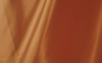 Free Video Stock texture of an orange fabric while waving