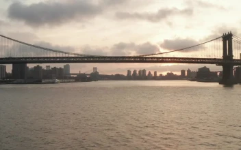 Free Video Stock the brooklyn bridge seen from the river aerial