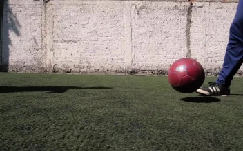 Free Video Stock the feet of a two boys playing football soccer