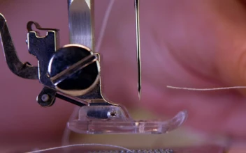 Free Video Stock threading a sewing machine needle