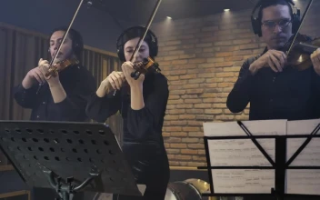 Free Video Stock three expert violinists playing together in a studio