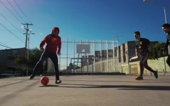 Free Video Stock three men playing soccer in concrete field