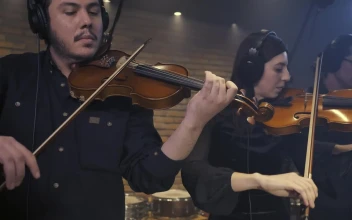 Free Video Stock three violinists playing together in a recording studio 41690
