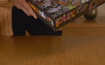 Free Video Stock throwing puzzle pieces out of a box