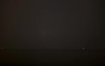 Free Video Stock thunderstorm lighting up the ocean