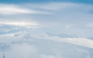 Free Video Stock tilt shot in a foggy winter mountains
