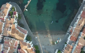 Free Video Stock tiny beach next to a harbor