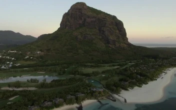 Free Video Stock tiny village in the shadow of a mountain