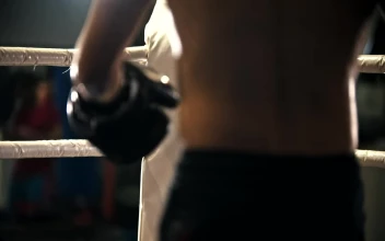 Free Video Stock tired amateur boxer in the corner of the ring while