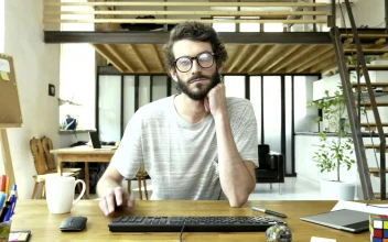 Free Video Stock tired and bored man in front of a computer
