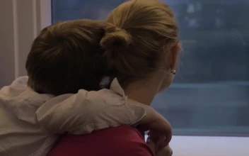 Free Video Stock tired boy holding onto his mother