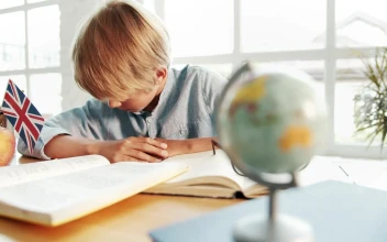 Free Video Stock tired boy wakes up after falling alseep on desk in