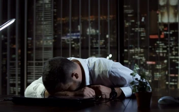 Free Video Stock tired man sleeping at his desk in the office