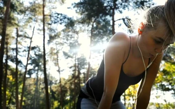 Free Video Stock tired woman jogging outside stops for a breath