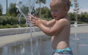 Free Video Stock toddler playing in a water fountain
