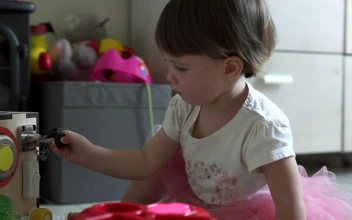 Free Video Stock toddler playing with a homemade toy