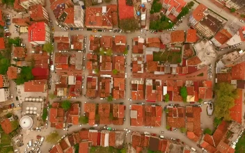 Free Video Stock top aerial shot from afar of a little town