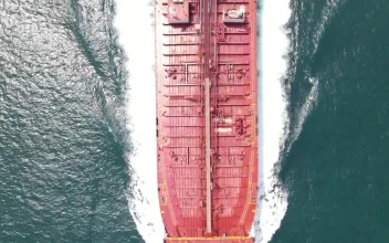 Free Video Stock top aerial shot of a cargo ship sailing in sea