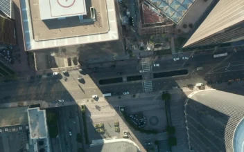 Free Video Stock top aerial shot of a city with little traffic