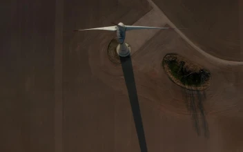 Free Video Stock top aerial shot of a wind turbine spinning