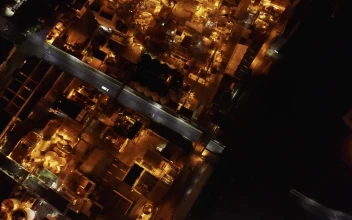 Free Video Stock top aerial view of a factory during night time