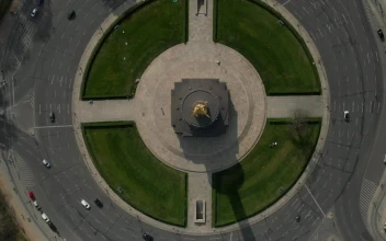 Free Video Stock top shot of a statue roundabout in the city