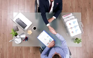 Free Video Stock top view of business handshake and client meeting