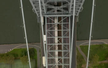 Free Video Stock top view of train and traffic crossing a bridge