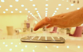 Free Video Stock touching a cell with one finger in a shop