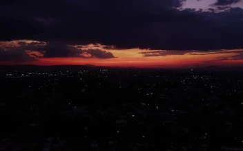 Free Video Stock tour high above a city at dusk
