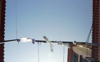 Free Video Stock tourist town street with shirts hung as decorations