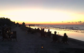 Free Video Stock tourists at a beach bar watching at sunset