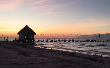 Free Video Stock tourists watching the sunset on a pier