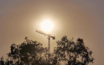 Free Video Stock tower crane during sunset seen in the distance