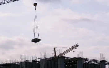 Free Video Stock tower crane with load on a construction site