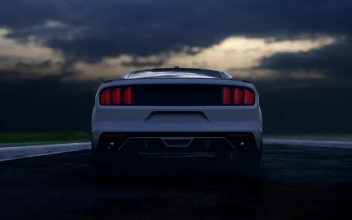 Free Video Stock tracking shot of a luxury sports car in a road