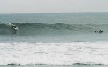 Free Video Stock tracking shot of a person surfing waves