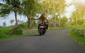 Free Video Stock tracking shot of a wanderlust couple riding a motorcycle