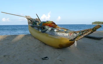 Free Video Stock traditional yellow fishing boat at the beach