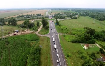 Free Video Stock traffic on a highway going through the countryside